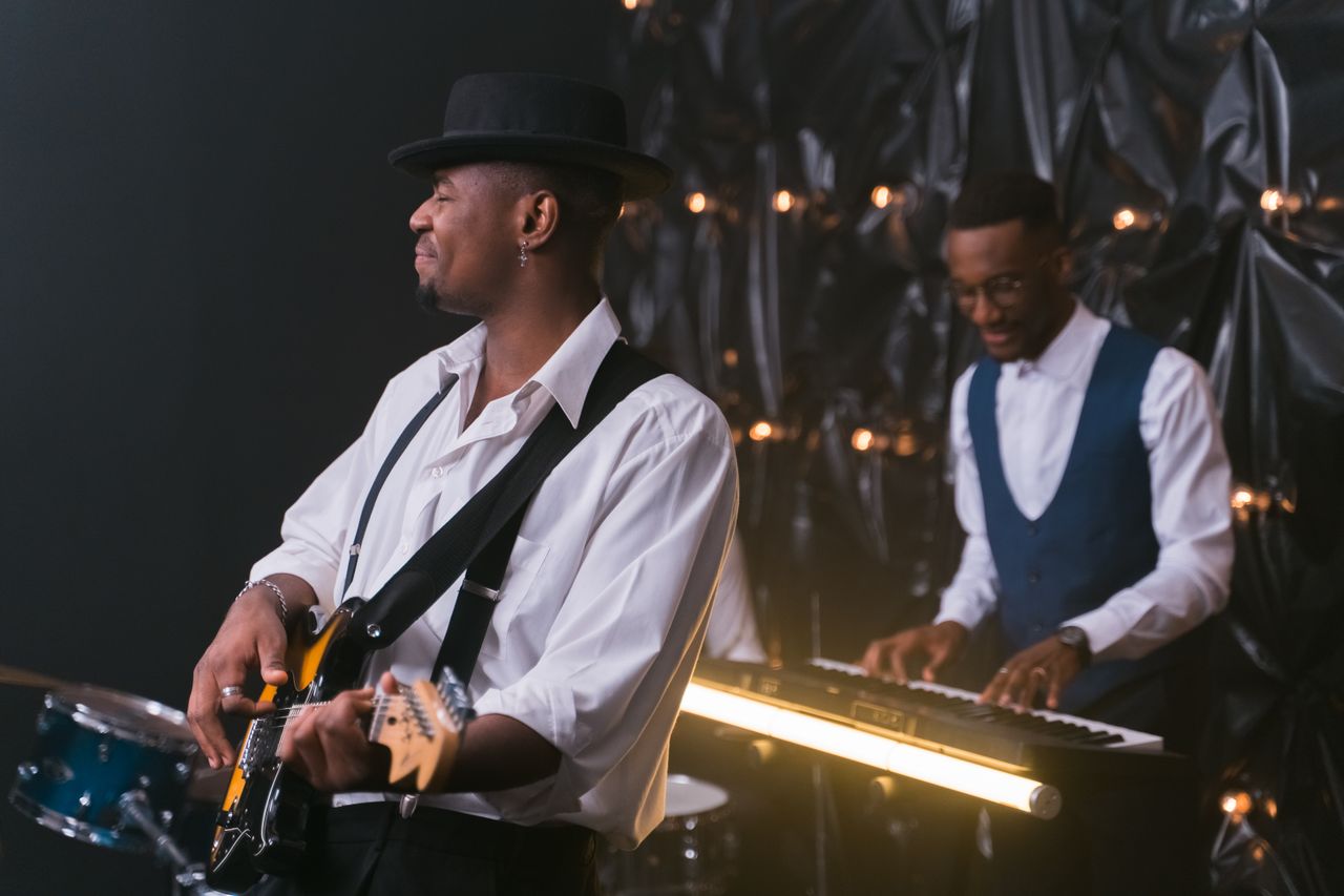 Services Energetic performance by jazz musicians with guitar and piano, creating soulful entertainment.